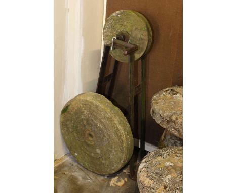 Weathered cast base vintage grind stone and weathered mill stone