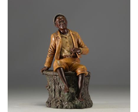 Bernhard BLOCH Beautiful polychrome terracotta tobacco pot depicting a young African man smoking a cigar. Signed "BB". - Weig
