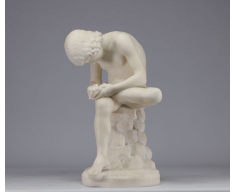 Marble sculpture "The thorn puller" from the ancient period. This sculpture shows a seated boy bending over to remove somethi