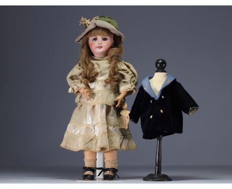 SFBJ - Cast bisque head doll, open mouth, sleeping blue eyes, debossed with SFBJ 301 Paris, between 1899 and 1920. - Weight: 