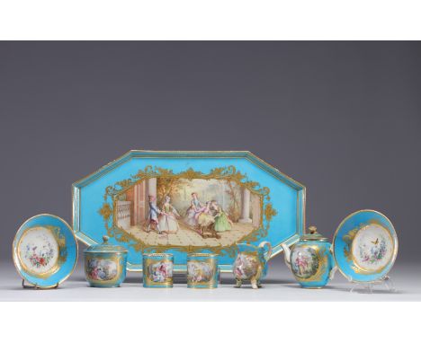 Sevres porcelain, "Tete a tete" service with a country decor on a celestial blue background enhanced with gold. It consists o