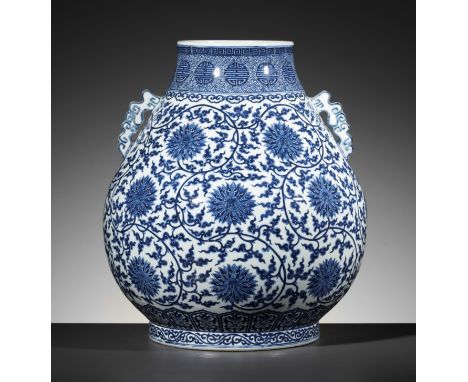 A FINE AND LARGE BLUE AND WHITE 'LOTUS' VASE, HU, QING DYNASTYChina, 1750-1850. The pear-shaped body rising from a short, sli