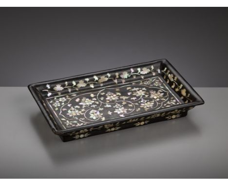 A MOTHER-OF-PEARL-INLAID BLACK LACQUER RECTANGULAR TRAY, JOSEON DYNASTYKorea, 16th-17th century. With a wide flaring rim, sup