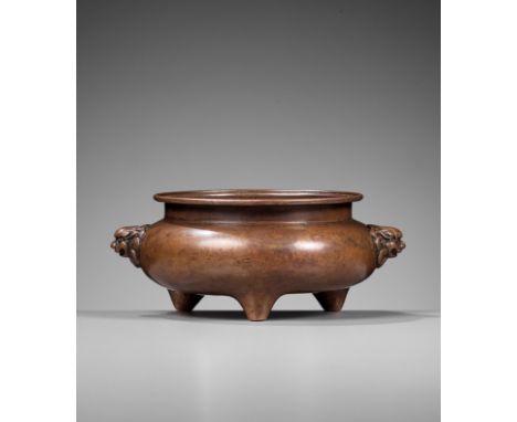 A COPPER ALLOY TRIPOD CENSER, 18TH CENTURYChina. The compressed globular body supported on three tapered feet with waisted ne