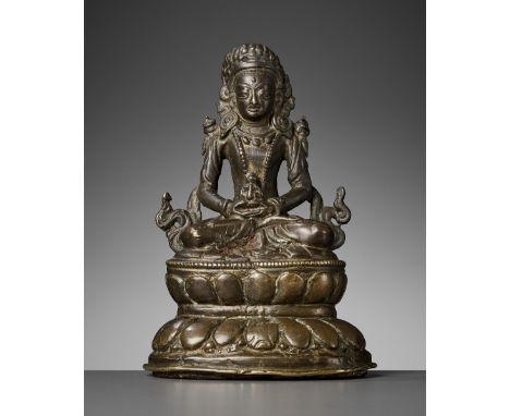 A NEPALESE BRONZE FIGURE OF AMITAYUS, MEDIEVAL PERIODC. 11th-14th century. Seated in dhyanasana atop a waisted double-lotus b