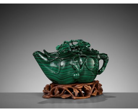 A MALACHITE 'DOUBLE GOURD' WATER DROPPER, LATE QING TO REPUBLICChina, 1860-1940. Carved in the form of a double gourd borne f