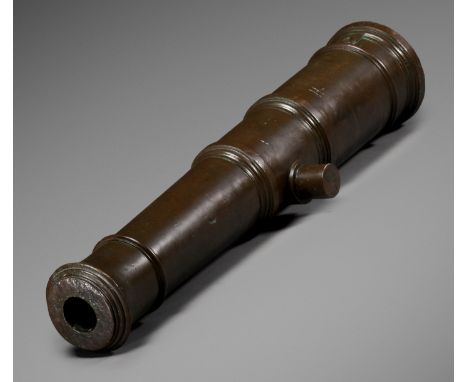 A BRONZE CANNON, QING DYNASTY, DAOGUANG PERIODChina, 1821-1850. Massively cast in tapering cylindrical form with raised ribs 