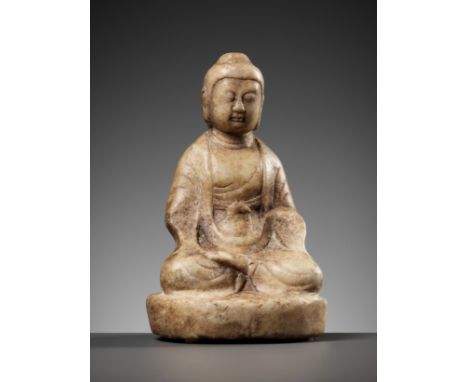A MARBLE FIGURE OF BUDDHA, TANG DYNASTYChina, 618-907. Buddha is shown seated in padmasana on an oval base, dressed in heavy 