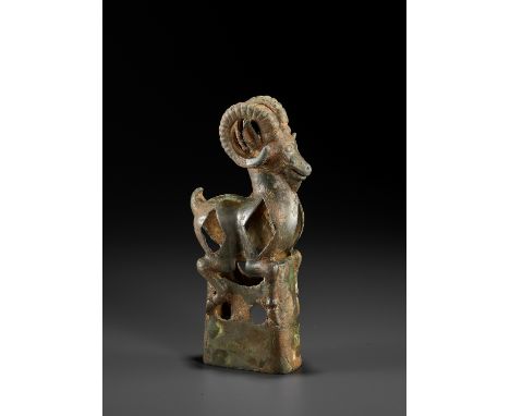 AN 'IBEX' BRONZE FINIAL, SOUTHERN SIBERIA, 6TH – 5TH CENTURY BCFinely cast in the form of an ibex with long, ribbed, and powe