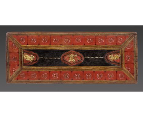 A PAINTED AND GILT WOOD MANUSCRIPT COVER, TIBET, 14TH-15TH CENTURYOf rectangular form, the central panel finely carved in dee
