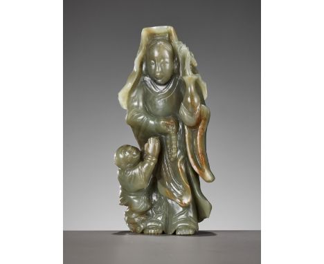 A DEEP CELADON AND RUSSET JADE 'GUANYIN AND SHANCAI' GROUP, QING DYNASTYChina, 18th-19th century. The bodhisattva of compassi