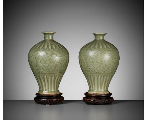 A PAIR OF LONGQUAN CELADON VASES, MEIPING, MING DYNASTYChina, 1368-1644. Heavily potted, the high-shouldered bodies tapering 