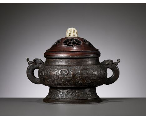 A BRONZE CENSER, GUI, WITH A WOOD COVER AND A JADE FINIAL, YUAN TO MING DYNASTYOpinion: While at first glance the form and ar
