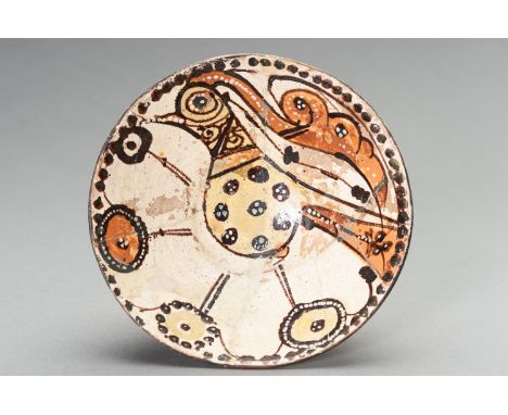 A SARI WARE SLIP-PAINTED POTTERY 'BIRD' BOWLNorthern Persia, 10th-11th century. With deep rounded sides supported on a short 