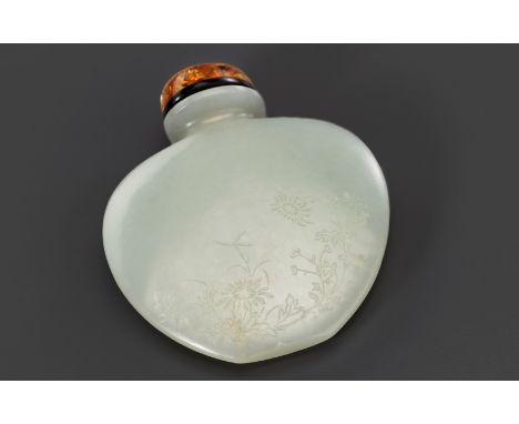 A PALE CELADON JADE 'PEONY AND CHRYSANTHEMUM' SNUFF BOTTLE, POSSIBLY IMPERIAL, 1750-1850Opinion: The bottle's superb hollowin