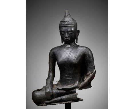 AN EARLY BRONZE FRAGMENT OF BUDDHA, PYU KINGDOMBurma, 8th-9th century. Cast seated in vajrasana on a pedestal, his right hand