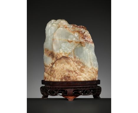 A CELADON AND RUSSET JADE MINIATURE MOUNTAIN, QING DYNASTYChina, 1644-1912. Carved to the front with two wayfarers pulling ho