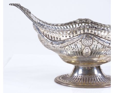 A late Victorian large silver table centre bon bon basket, with pierced surround, relief embossed swag decoration, and shell 