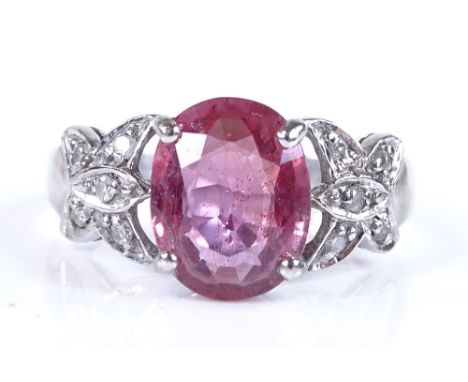 An 18ct white gold ruby and diamond dress ring, ruby height 10mm, size K, 4.3g 