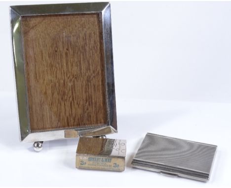 A rectangular silver-fronted photo frame, internal dimensions 12.5cm x 9cm, together with an Art Deco silver cigarette case, 