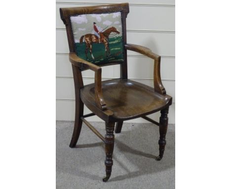 A Victorian oak desk elbow chair, with tapestry upholstered back 