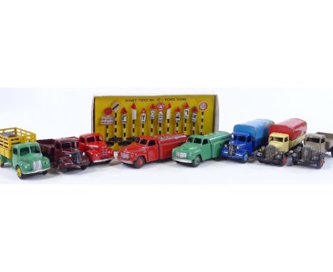 Dinky Meccano, 8 unboxed trucks and sets of boxed road signs 47 