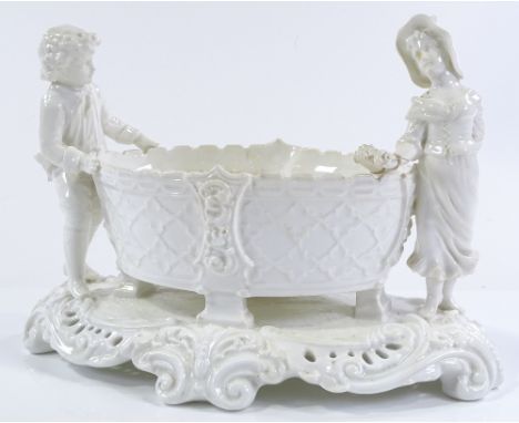 A Victorian Moore Brothers ceramic table centre basket, flanked by 2 children figures, length 29cm, 1 arm A/F 