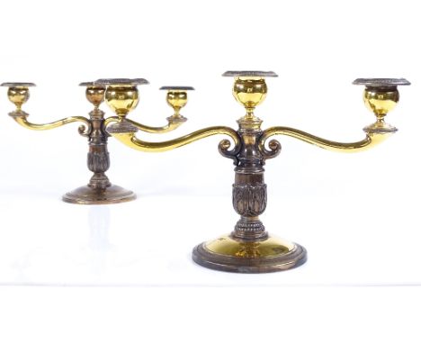 A pair of sterling silver gilt 2-branch candelabra, with removable fittings, with warthog above W stamp, height 16.5cm, 28.5o