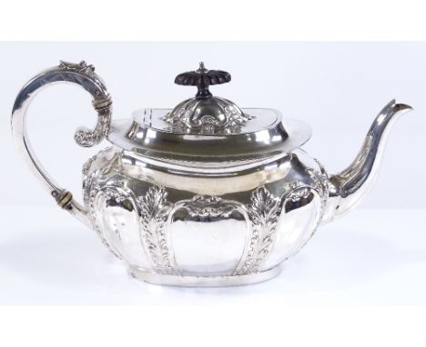 An Edwardian oval silver teapot, with acanthus leaf decoration and ivory insulators, height 15cm, by James Dickson &amp; Sons