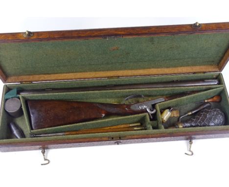 An Antique double-barrel muzzle loading percussion sporting gun, with dolphin design hammers, and engraved lock plates, in Vi