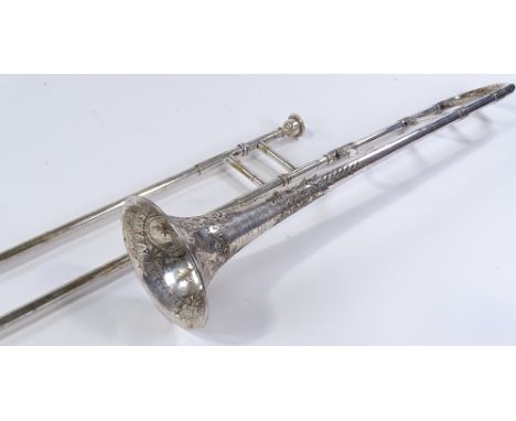 A Victorian silver plated trombone by Joseph Higham of Manchester, with engraved decoration and inscription dated 1895