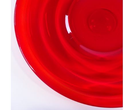 A large Whitefriars ruby red ribbed circular glass dish, diameter 35cm 
