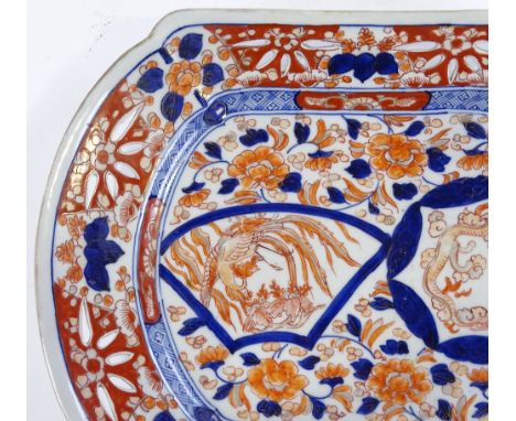 A Chinese porcelain dish with pierced surround, and hand painted dragon decoration, length 37cm 