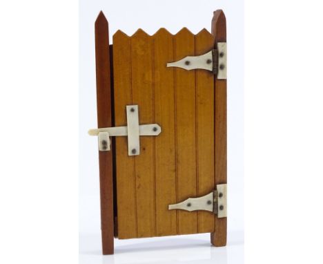 A Victorian novelty stained wood photo frame in the form of a garden gate, with ivory mounts, height 13cm 