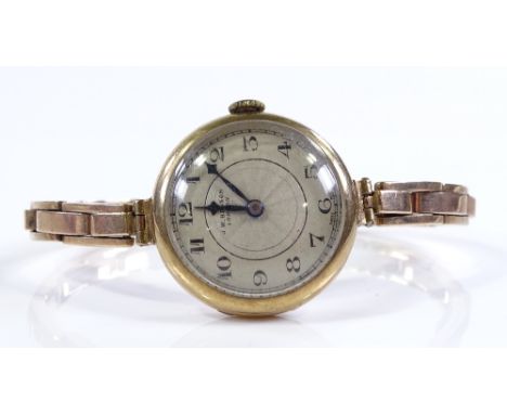A lady's 9ct gold Vintage J W Benson Mechanical wristwatch, 15 jewel movement on 9ct expanding strap, serial no. 889351, case