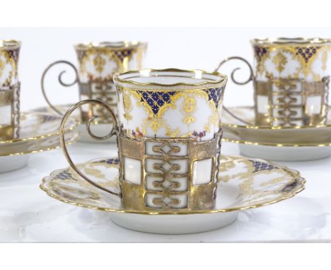 A set of 4 Aynsley gilded china coffee cups and saucers, in silver holders 