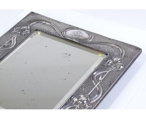 A large Art Nouveau silver-fronted rectangular mirror, with relief embossed tulip border, by A&amp;J Zimmermann, hallmarks Bi