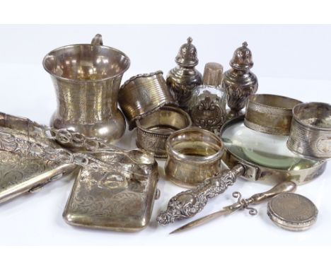 Various silver items, including a thistle shaped mug, a curved cigarette case, napkin rings etc, 13.8oz weighable 