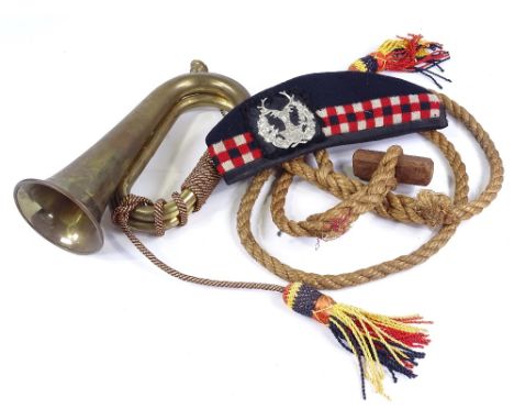 A Scottish military side cap, military bugle, and paratrooper's toggle rope (3) 