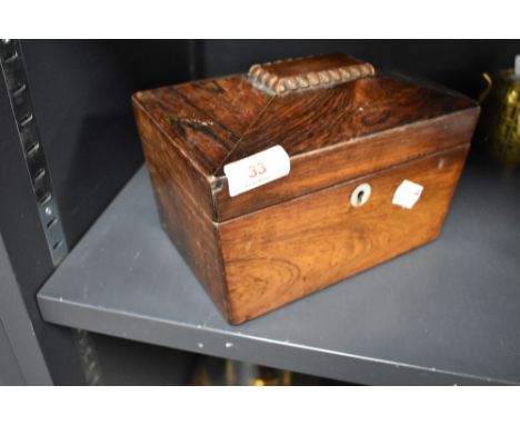 A 19th century rosewood tea caddy, of sarcophagus form, with circular Mother-of-Pearl escutcheon