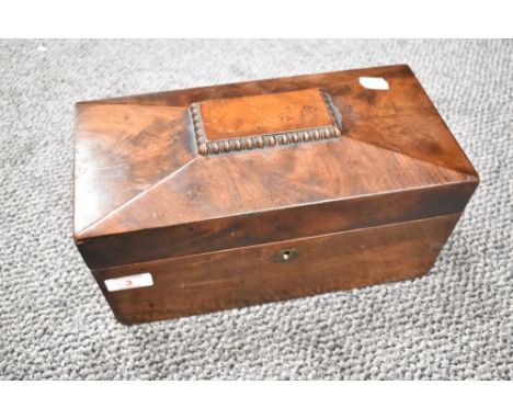 A 19th century mahogany sarcophagus-form tea caddy, with internal compartments and replacement glass mixing bowl