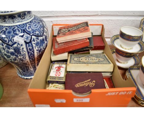 An assortment of vintage playing cards and card games.