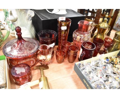 A selection if 19th century etched ruby tinted glass wares, to include lidded jar, beaker, vase, glasses