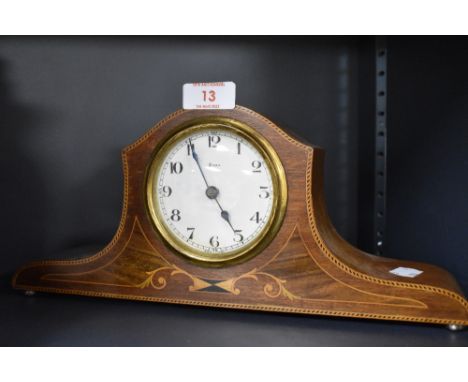 An Edwardian inlaid-mahogany mantel clock, the dial with Arabic hours marked '8 Day' 'Made in France'