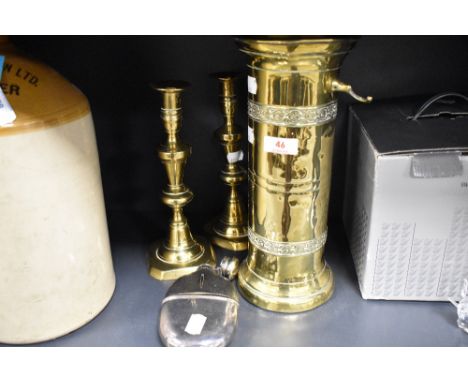 An early 20th century cylindrical brass companion stand, a pair of brass candlesticks and silver plate and leather covered hi