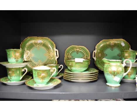 A Noritake green and gilt decorated six setting teaset, to include two side plates
Condition Report: Damage and glued repair 