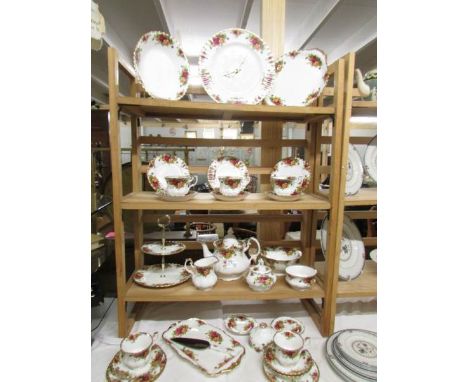 Approximately 30 pieces of Royal Albert Old Country Roses tea ware including clock and cake stand.