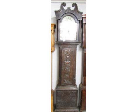 A carved oak long case clock with painted arched dial, 'Wm Bowers, Chesterfield'.
