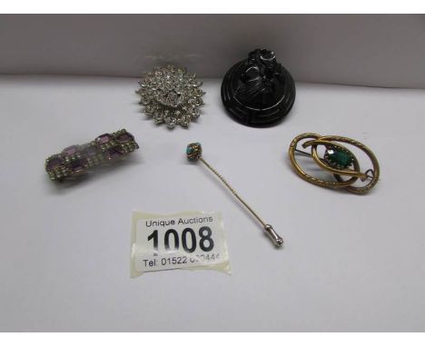 A Victorian brooch, 2 other brooches, a French jet brooch and a stick pin.