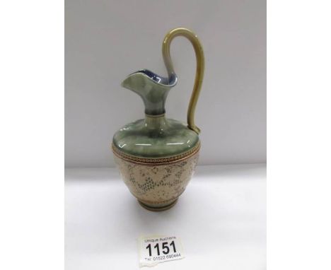 A 19th century ceramic jug with various markings to base including Doulton Lambeth and Doulton &amp; Slater.